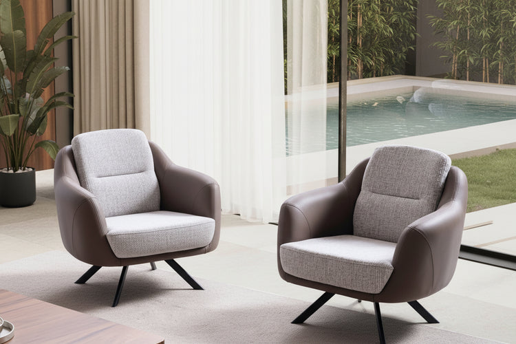 Modern armchair in a room with large windows and curtains